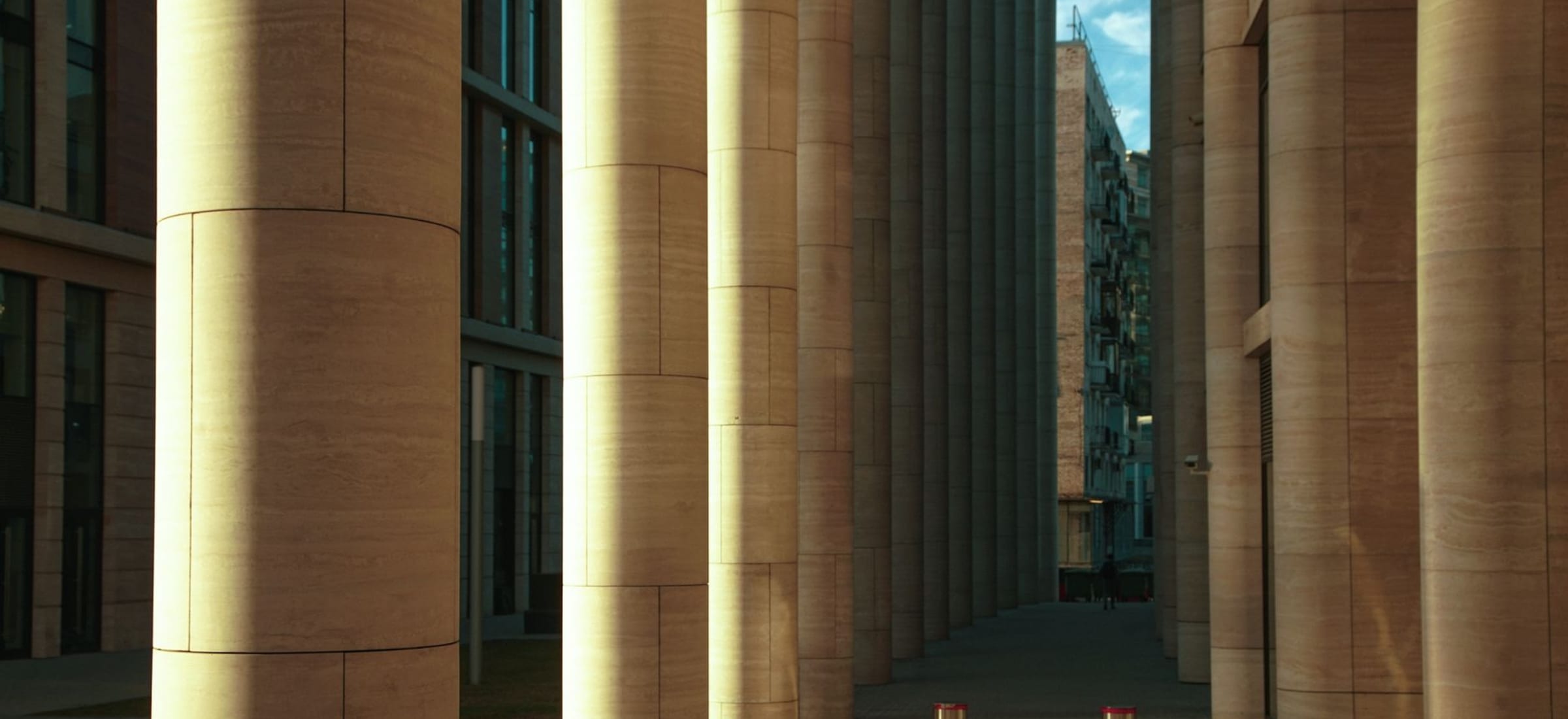 Calm daylight on the stone facade of a civic building
